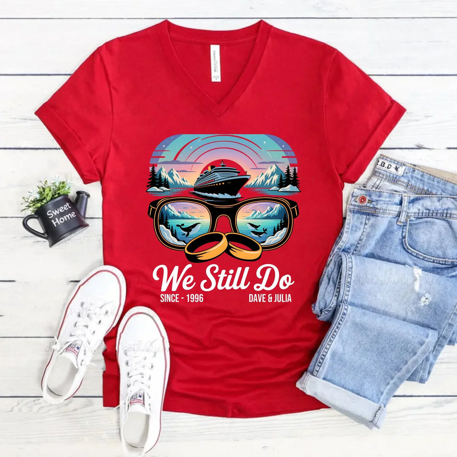 Red custom graphic tee with cruise ship, sunglasses, rings, and 'We Still Do' anniversary text