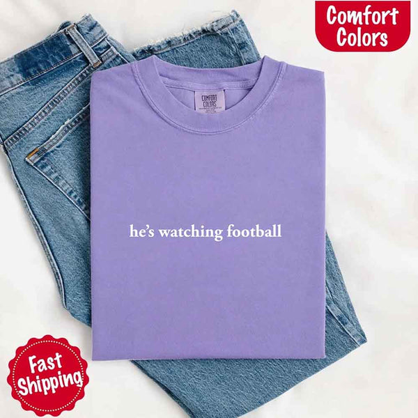 He’s Watching Football Tee - Comfort Colors Funny Shirt for Her