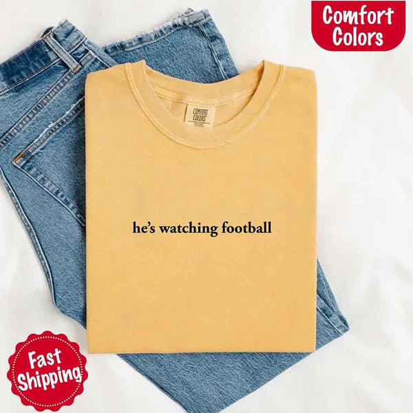 He’s Watching Football Tee - Comfort Colors Funny Shirt for Her