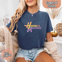 May include a woman wearing a blue jean Comfort Colors T-shirt with the phrase “having a meltdown” in bold black text, styled for a humorous and relatable casual look.