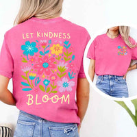 May include a woman wearing a Crunchberry Comfort Colors T-shirt with colorful floral graphics and the phrase “Let Kindness Bloom” printed on the back, styled with light denim for a cheerful and uplifting look.