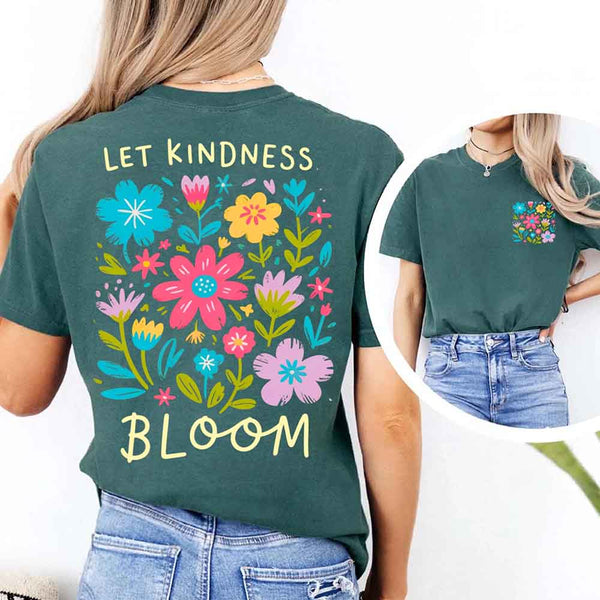 May include a woman wearing a Moss Comfort Colors T-shirt with colorful floral graphics and the phrase “Let Kindness Bloom” printed on the back, styled with light denim for a cheerful and uplifting look.