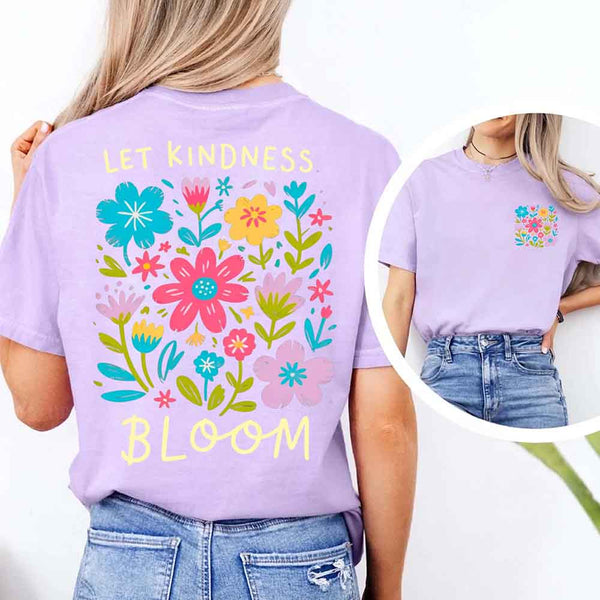 May include a woman wearing a Orchid Comfort Colors T-shirt with colorful floral graphics and the phrase “Let Kindness Bloom” printed on the back, styled with light denim for a cheerful and uplifting look.