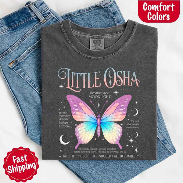 May include a folded Pepper Comfort Colors T-shirt with a Quicksilver-inspired butterfly design, neatly placed over denim jeans for a gentle and dreamy aesthetic.
