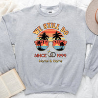 Gray sweatshirt with sunglasses and palm tree design, featuring text 'We Still Do Since 1999'.