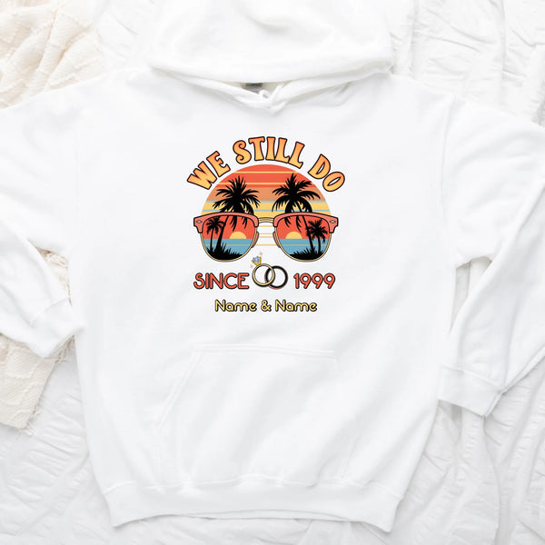 White sweatshirt with a tropical design and text on a white background