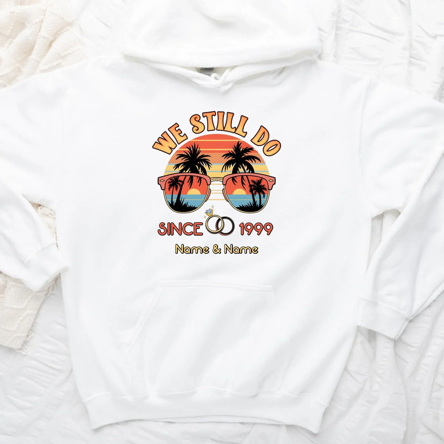 White sweatshirt with a tropical design and text on a white background