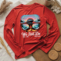 Red long sleeve custom tee with cruise ship and sunglasses graphic, 'We Still Do' text, personalized design