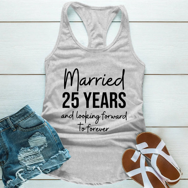 Gray tank top with 'Married 25 Years and looking forward to forever' text, paired with denim shorts and sandals on a light wooden surface.