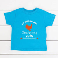 May include matching family t-shirts with a Thankful Fall theme, personalized with individual names, designed for Thanksgiving gatherings.