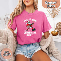 May include a Comfort Colors unisex t-shirt featuring a vintage-style Santa Claus graphic and the text “Smells Like Christmas Spirit” printed on soft cotton fabric.