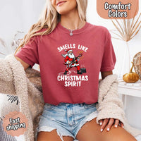 May include a Comfort Colors unisex t-shirt featuring a vintage-style Santa Claus graphic and the text “Smells Like Christmas Spirit” printed on soft cotton fabric.