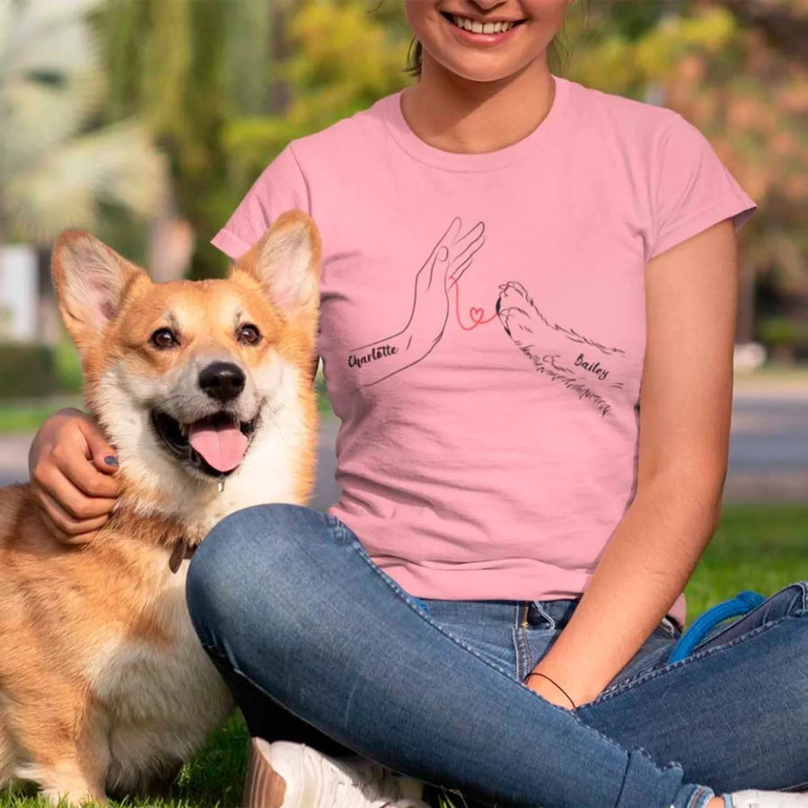 May include a personalized shirt with a dog paw and human hand joined by a red thread heart, with space for a custom pet name.