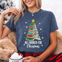 May include an All Booked for Christmas Book Lover Comfort Colors T-Shirt featuring a festive Christmas and reading-inspired design.