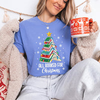 May include an All Booked for Christmas Book Lover Comfort Colors T-Shirt featuring a festive Christmas and reading-inspired design.