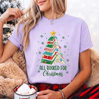 May include an All Booked for Christmas Book Lover Comfort Colors T-Shirt featuring a festive Christmas and reading-inspired design.