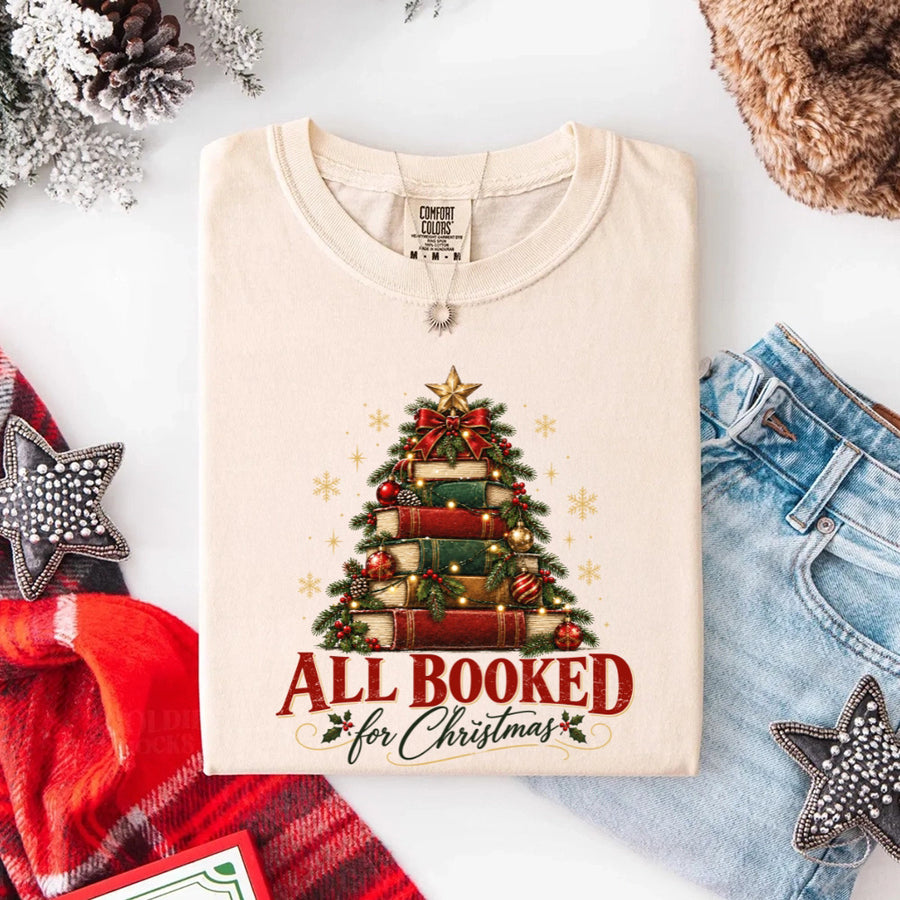 May include an All Booked for Christmas Comfort Colors T-Shirt featuring a festive book lover statement design.