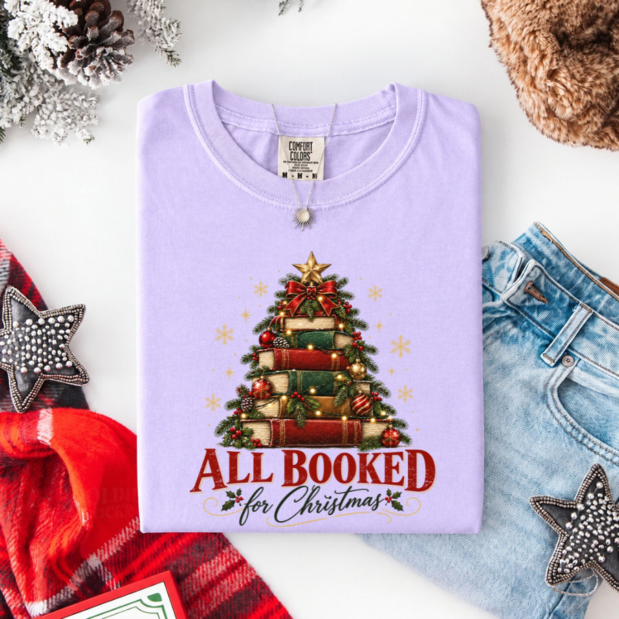 May include an All Booked for Christmas Comfort Colors T-Shirt featuring a festive book lover statement design.
