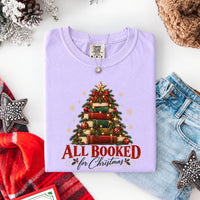 May include an All Booked for Christmas Comfort Colors T-Shirt featuring a festive book lover statement design.