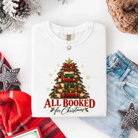 May include an All Booked for Christmas Comfort Colors T-Shirt featuring a festive book lover statement design.