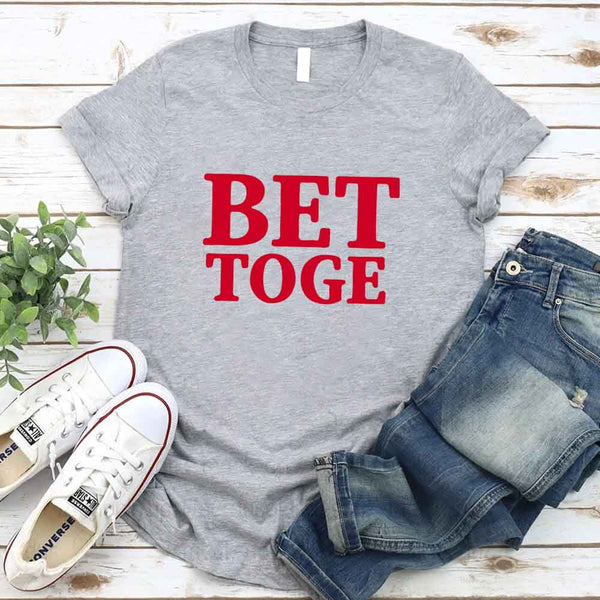 May include a “Better Together” couples T-shirt design with bold, friendly lettering arranged in a balanced layout, often paired with a small heart or link-style graphic that reflects unity and closeness.