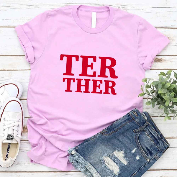 May include a “Better Together” couples T-shirt design with bold, friendly lettering arranged in a balanced layout, often paired with a small heart or link-style graphic that reflects unity and closeness.