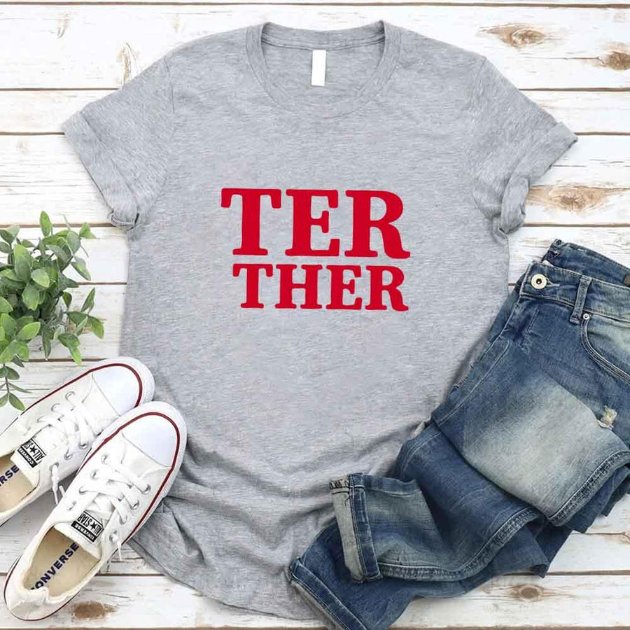 May include a “Better Together” couples T-shirt design with bold, friendly lettering arranged in a balanced layout, often paired with a small heart or link-style graphic that reflects unity and closeness.