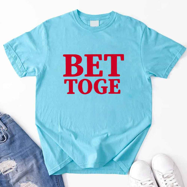 May include a “Better Together” couples T-shirt design with bold, friendly lettering arranged in a balanced layout, often paired with a small heart or link-style graphic that reflects unity and closeness.