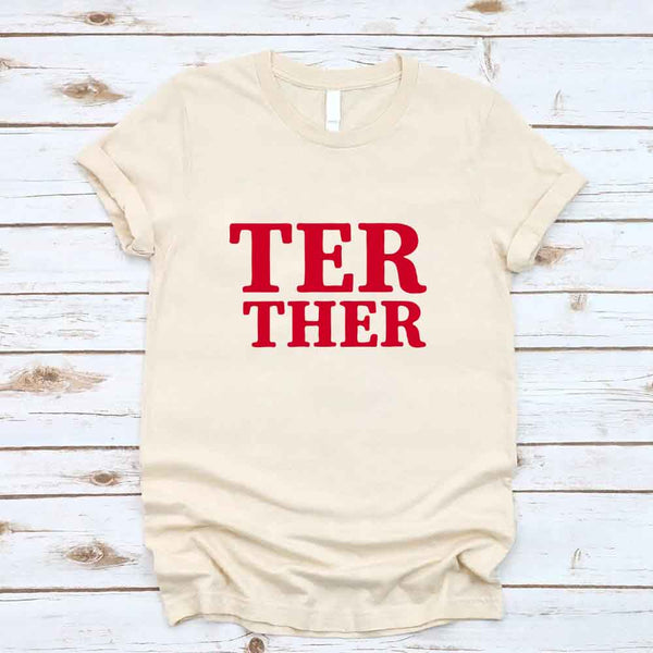 May include a “Better Together” couples T-shirt design with bold, friendly lettering arranged in a balanced layout, often paired with a small heart or link-style graphic that reflects unity and closeness.