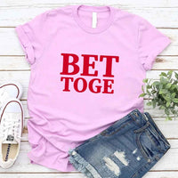 May include a “Better Together” couples T-shirt design with bold, friendly lettering arranged in a balanced layout, often paired with a small heart or link-style graphic that reflects unity and closeness.