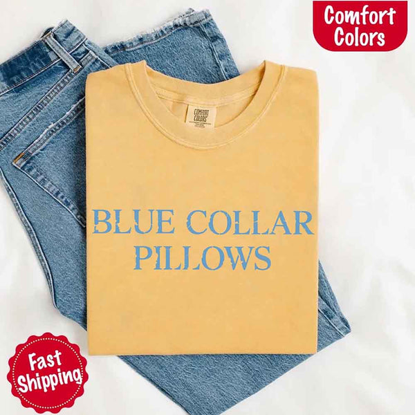 May include light blue distressed text that reads “Blue Collar Pillows,” using a simple serif font to evoke hardworking pride with a touch of rugged charm.
