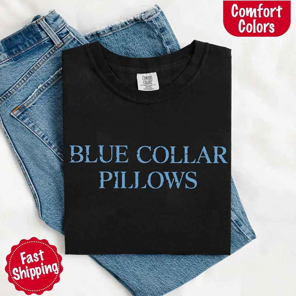 May include light blue distressed text that reads “Blue Collar Pillows,” using a simple serif font to evoke hardworking pride with a touch of rugged charm.