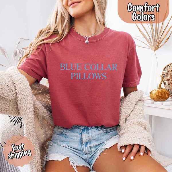 May include light blue distressed text that reads “Blue Collar Pillows,” using a simple serif font to evoke hardworking pride with a touch of rugged charm.