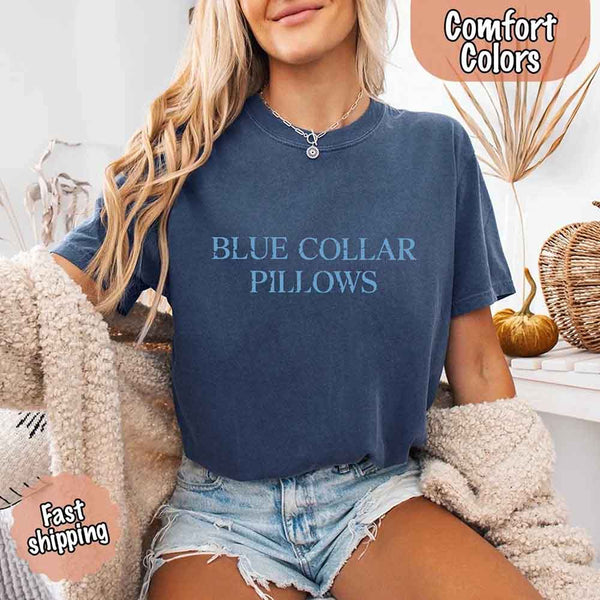 May include light blue distressed text that reads “Blue Collar Pillows,” using a simple serif font to evoke hardworking pride with a touch of rugged charm.