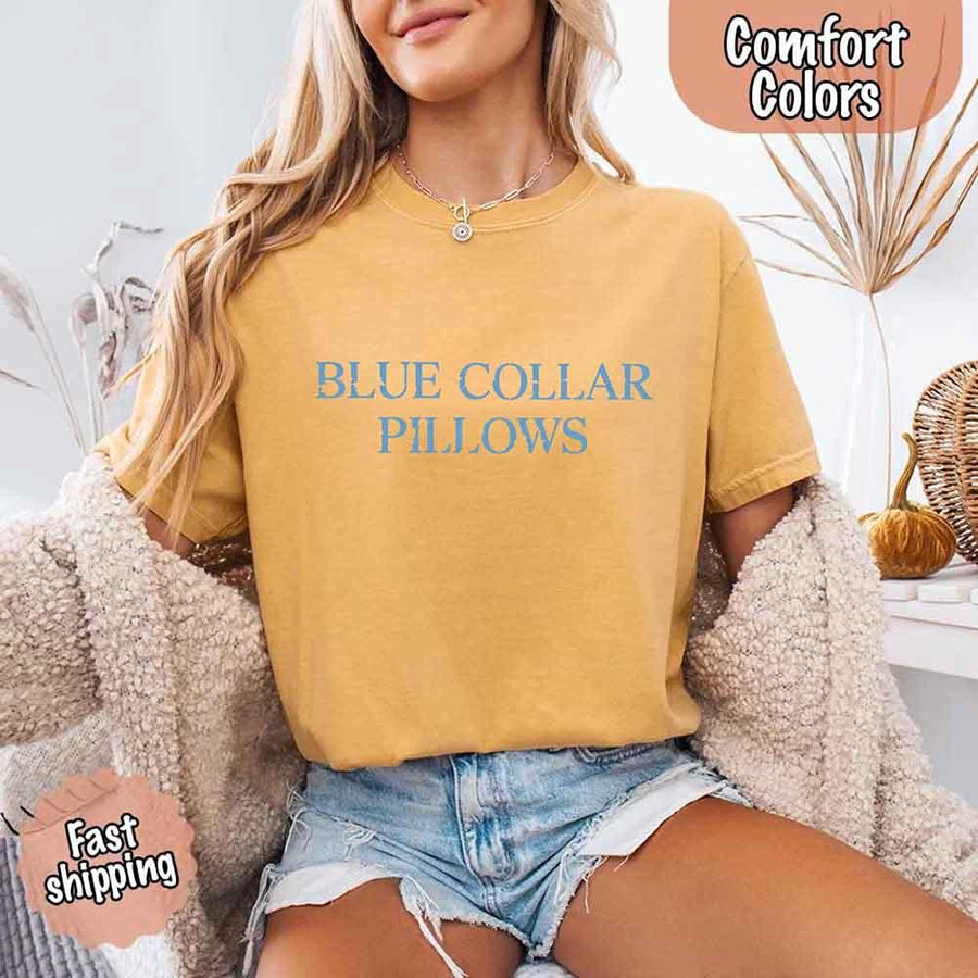 May include light blue distressed text that reads “Blue Collar Pillows,” using a simple serif font to evoke hardworking pride with a touch of rugged charm.