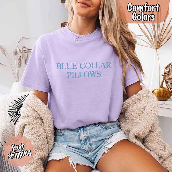 May include light blue distressed text that reads “Blue Collar Pillows,” using a simple serif font to evoke hardworking pride with a touch of rugged charm.