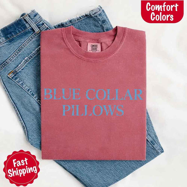 May include light blue distressed text that reads “Blue Collar Pillows,” using a simple serif font to evoke hardworking pride with a touch of rugged charm.