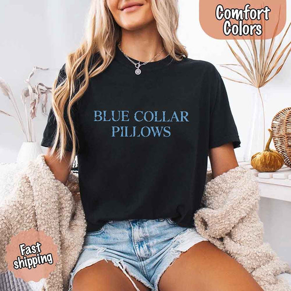 May include light blue distressed text that reads “Blue Collar Pillows,” using a simple serif font to evoke hardworking pride with a touch of rugged charm.