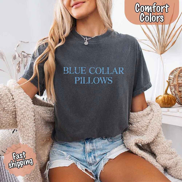 May include light blue distressed text that reads “Blue Collar Pillows,” using a simple serif font to evoke hardworking pride with a touch of rugged charm.