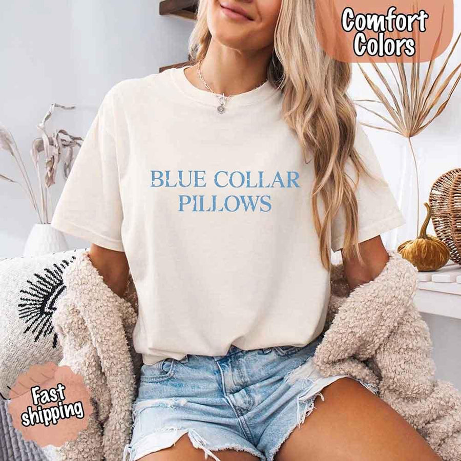 May include light blue distressed text that reads “Blue Collar Pillows,” using a simple serif font to evoke hardworking pride with a touch of rugged charm.