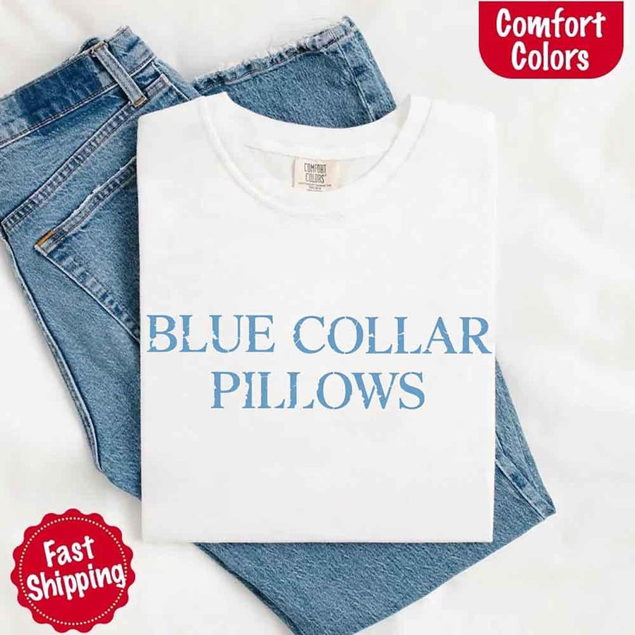 May include light blue distressed text that reads “Blue Collar Pillows,” using a simple serif font to evoke hardworking pride with a touch of rugged charm.