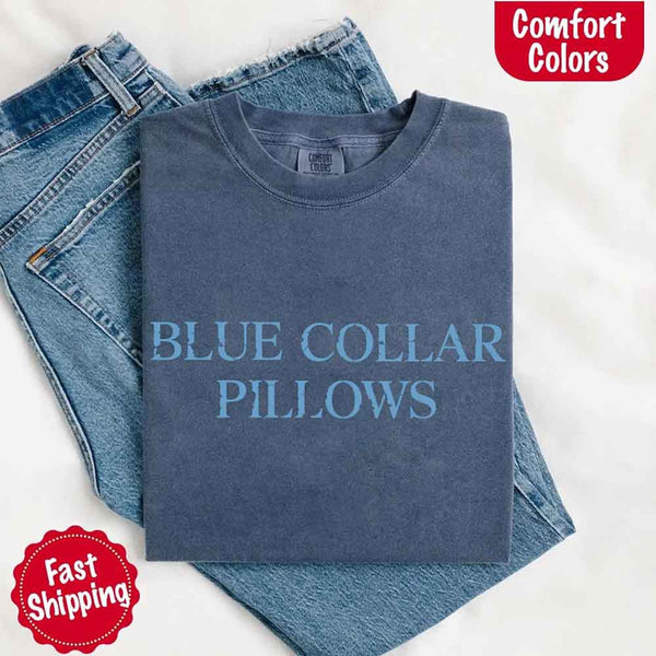 May include light blue distressed text that reads “Blue Collar Pillows,” using a simple serif font to evoke hardworking pride with a touch of rugged charm.