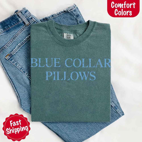 May include light blue distressed text that reads “Blue Collar Pillows,” using a simple serif font to evoke hardworking pride with a touch of rugged charm.