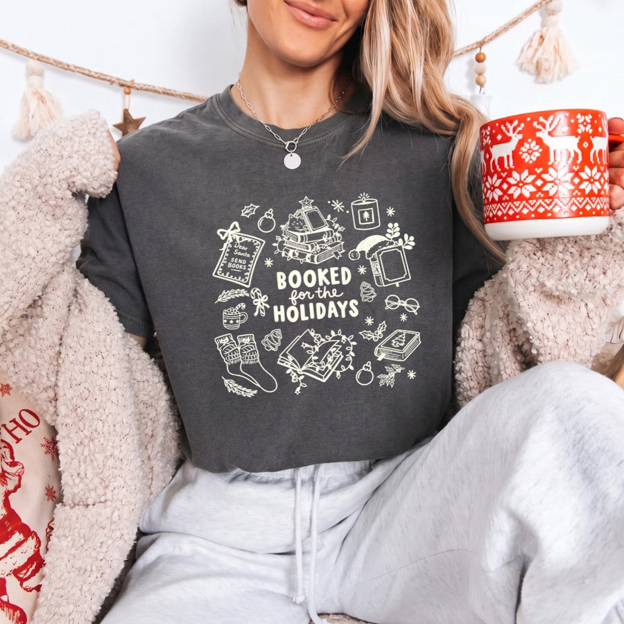 May include a Booked for the Holidays Comfort Colors T-Shirt featuring a festive Christmas and book-inspired statement design.