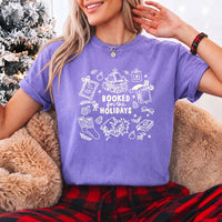 May include a Booked for the Holidays Comfort Colors T-Shirt featuring a festive Christmas and book-inspired statement design.