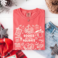 May include a Booked for the Holidays Comfort Colors T-Shirt featuring a festive Christmas and book-inspired statement design.