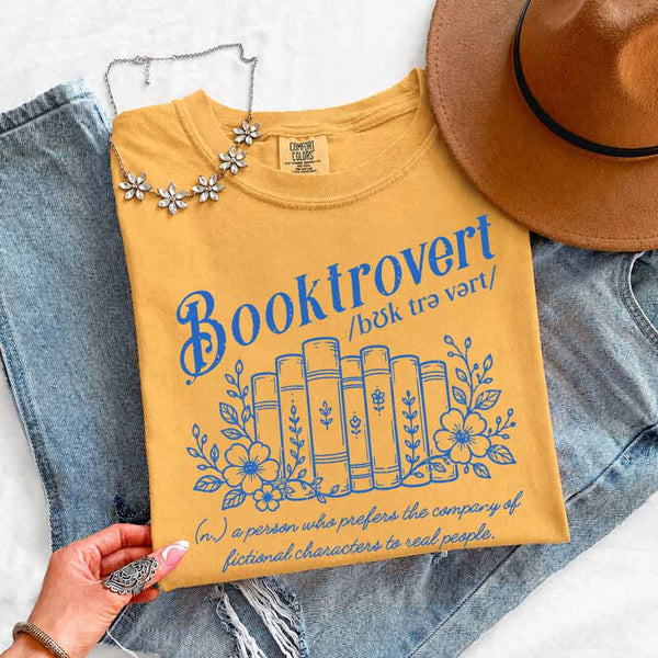 May include Booktrovert Comfort Colors t-shirt with book lover graphic, relaxed unisex fit, and garment-dyed cotton