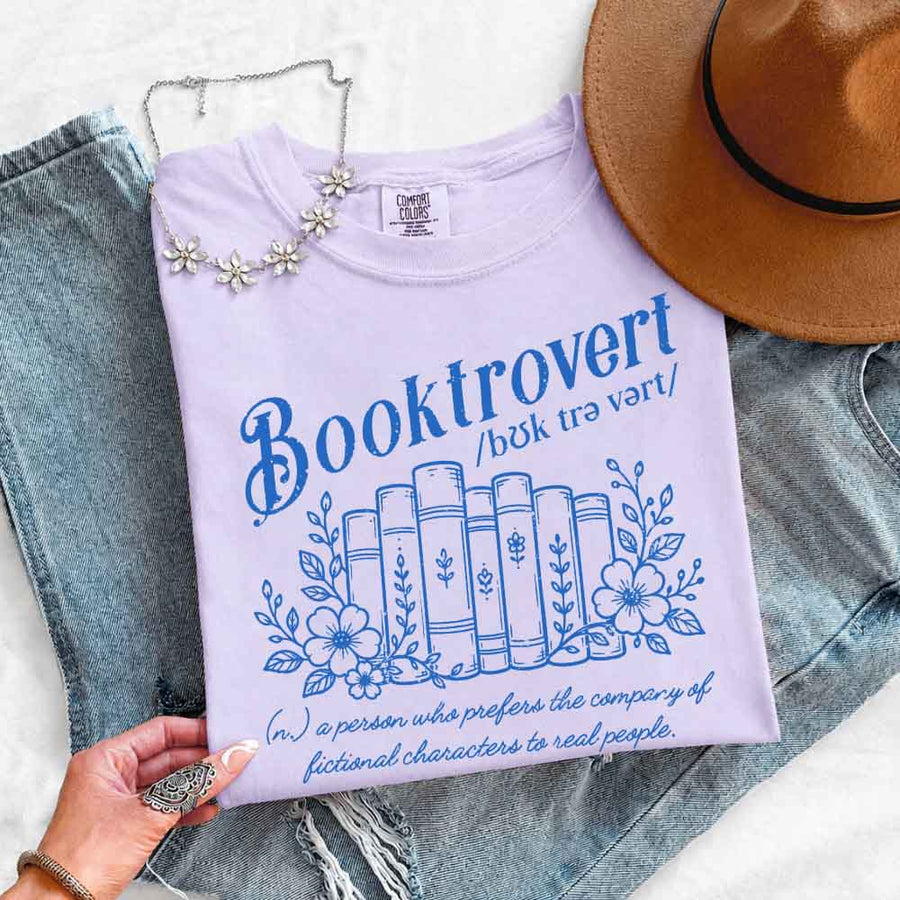 May include Booktrovert Comfort Colors t-shirt with book lover graphic, relaxed unisex fit, and garment-dyed cotton