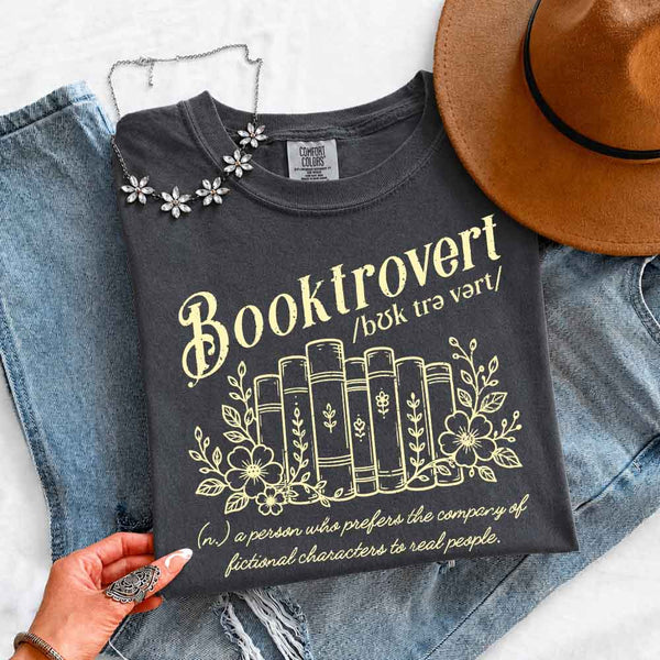 May include Booktrovert Comfort Colors t-shirt with book lover graphic, relaxed unisex fit, and garment-dyed cotton