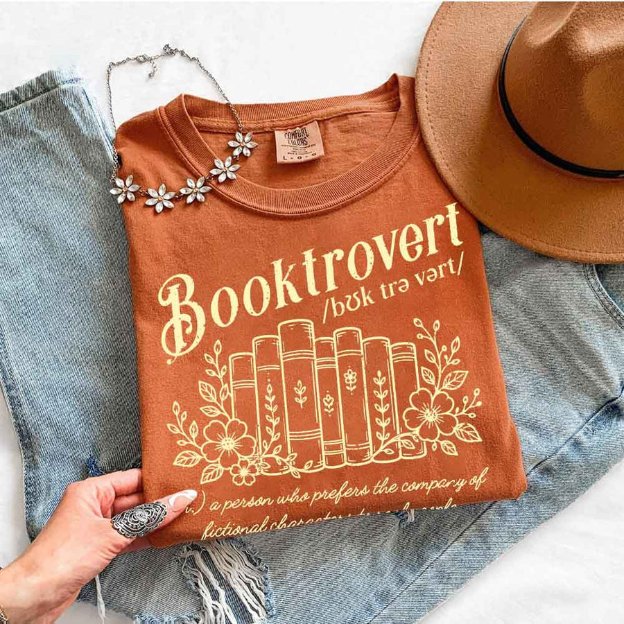 May include Booktrovert Comfort Colors t-shirt with book lover graphic, relaxed unisex fit, and garment-dyed cotton